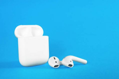 ROSTOV-ON-DON, RUSSIA - February 24, 2019: Apple AirPods wireless Bluetooth headphones and charging case for  Apple iPhone. New Apple Earpods Airpods in box.