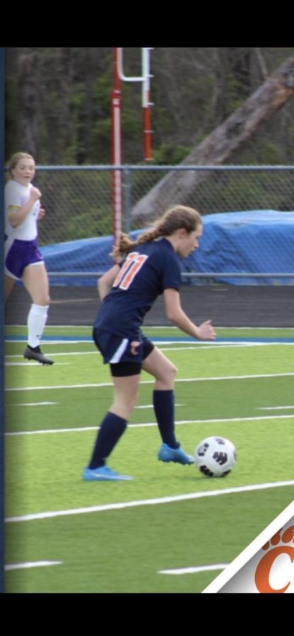 On April 9, Freshman Molly Robertson kicks the ball for the Carterville High School soccer team. 
