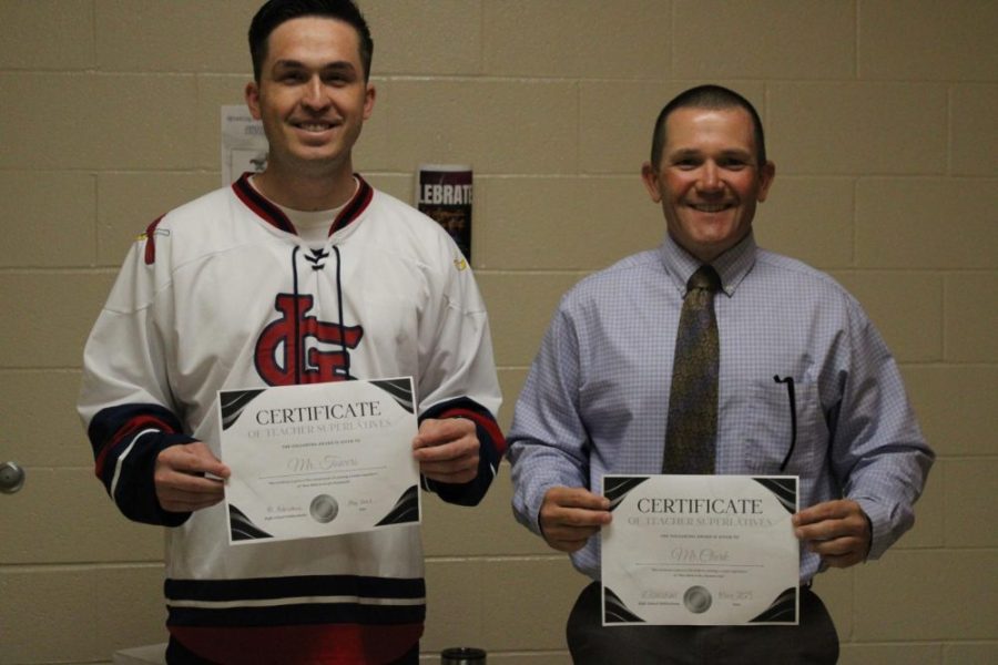 Mr.Towers and Mr.Clark holding their superlatives together as they get their photo taken.