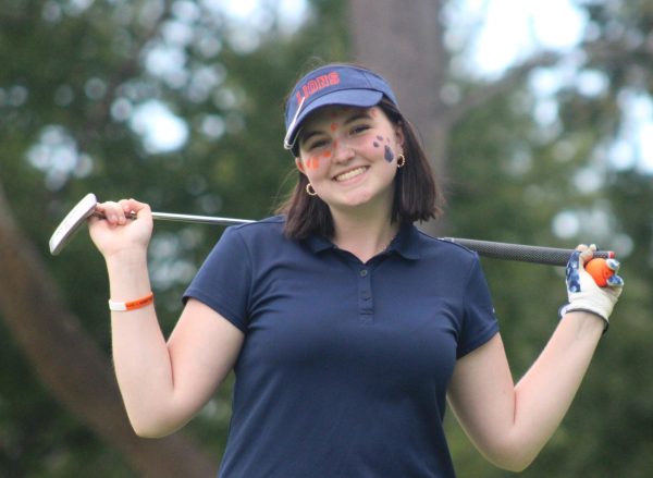 Phila Cowser (12) enjoying herself between holes on the golf course.  