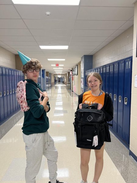 Sophomores Braidyn Hale and Nora Thatcher posed for a photo with bags that were collected during the advisory competition. 