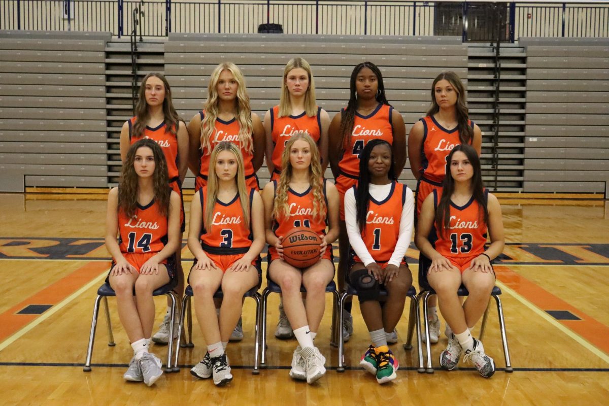 Girls players pose for a picture. 
