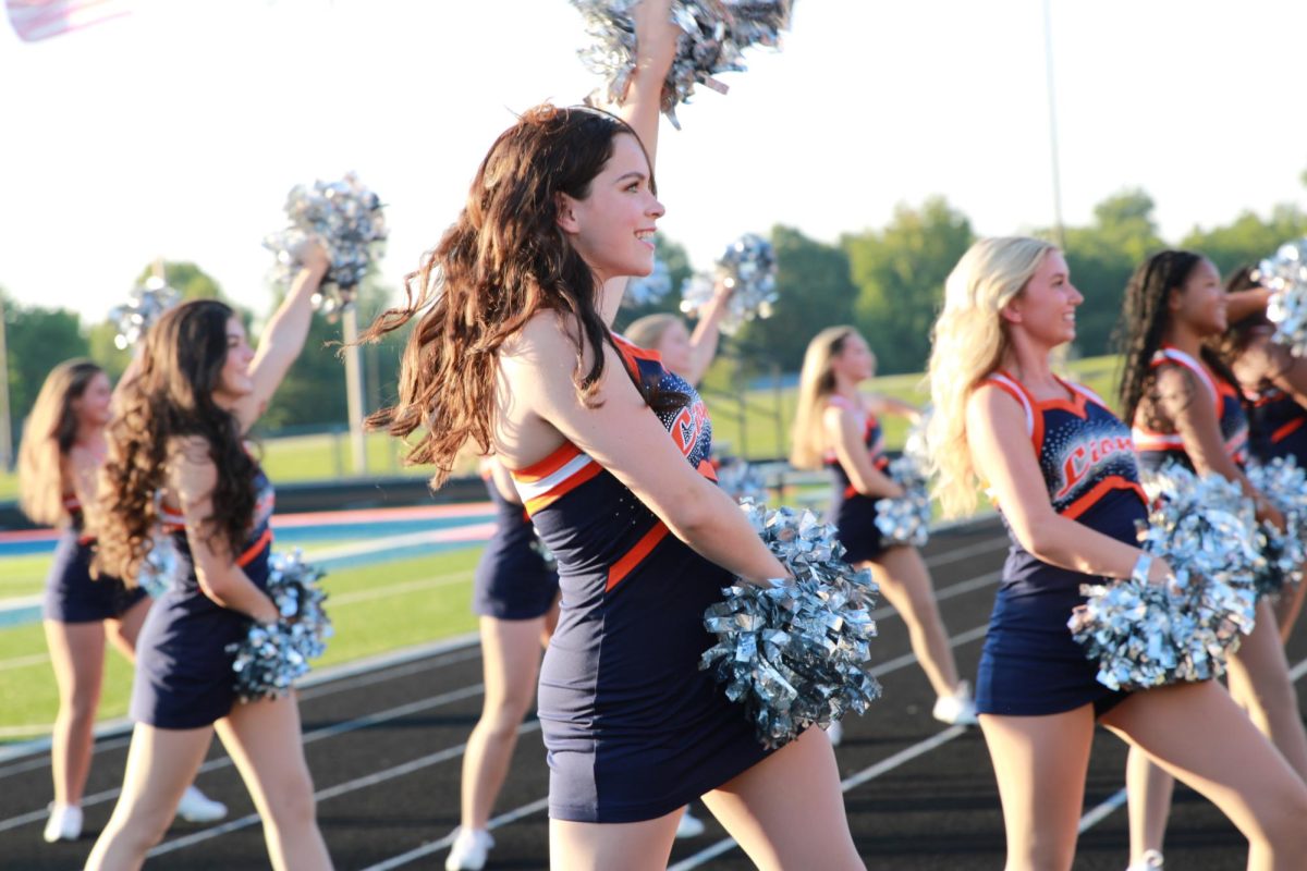 Senior Adyson Shepard dances on the sidelines at a Meet the Lions.