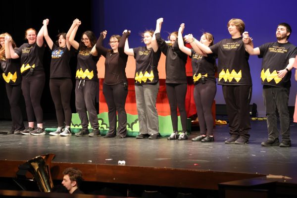 Crew members take a bow after the musical