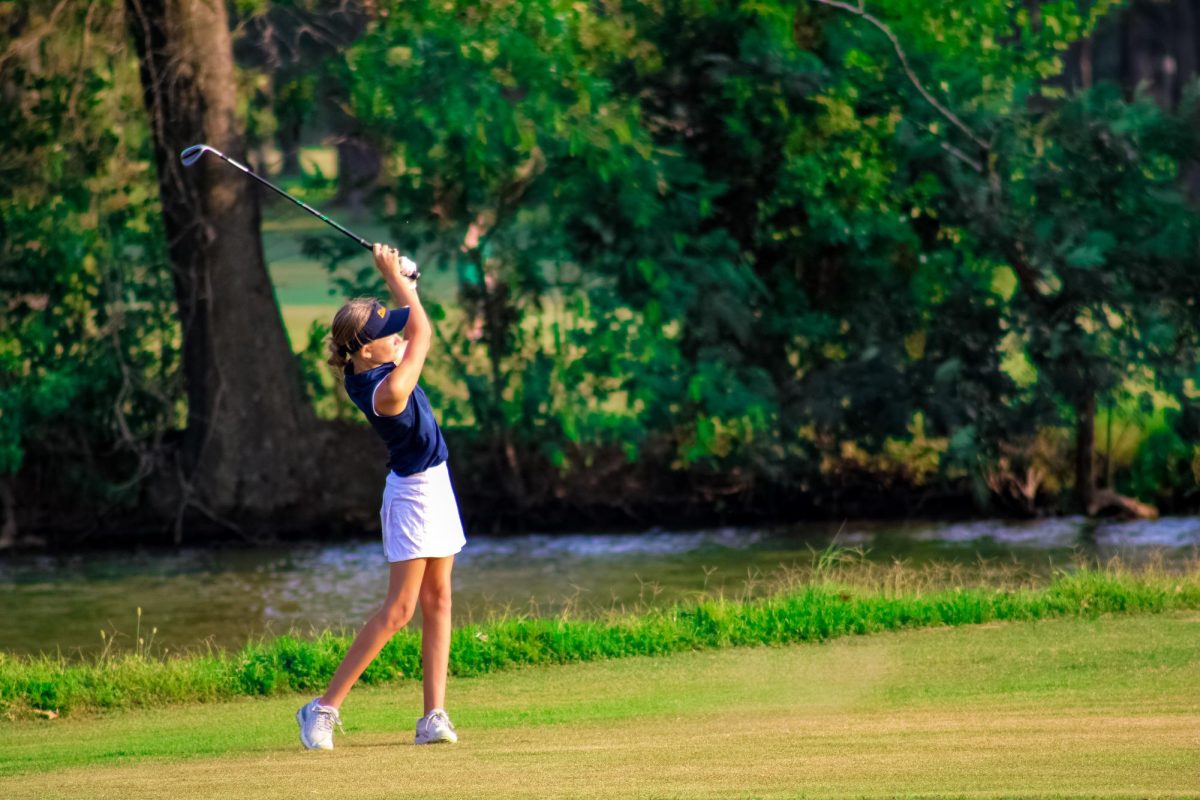 Merryn Elliot (9) hitting the golf ball on hole 5 at Crab Orchard Golf Course. 