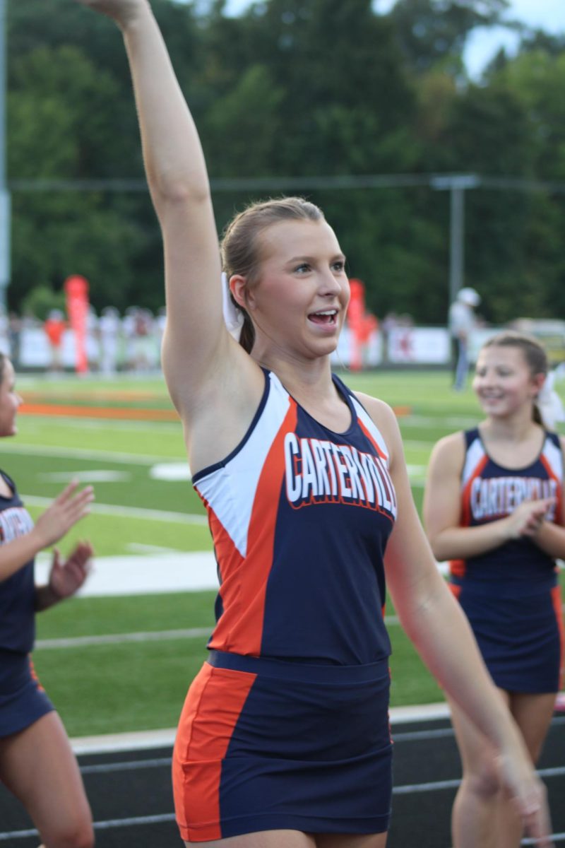 Mercedes Levesque (12) cheers at the first home football game of the season.