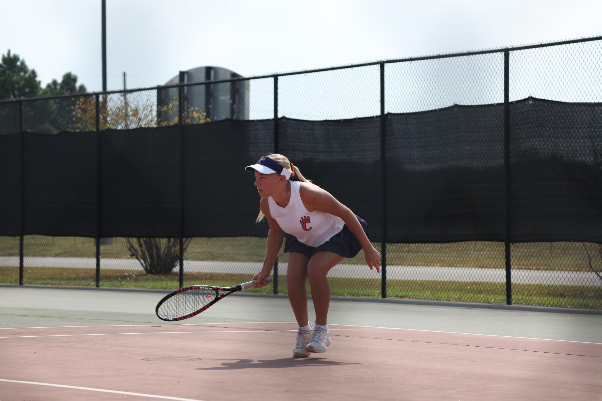 Team Captain Emerson Scherschel prepares to hit a forehand against Herrin's number three player at the team's fifth tournament. 