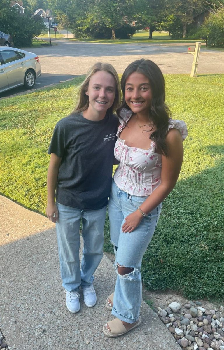 Senior Avery Chapman and Freshman Grace Chapman taking a picture before their first day of school.