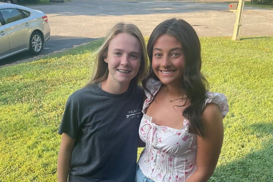 Senior Avery Chapman and Freshman Grace Chapman taking a picture before their first day of school.