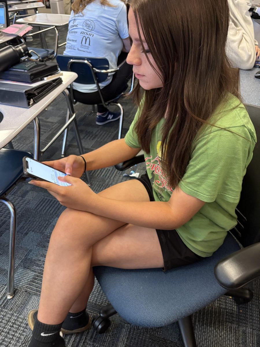 Freshman Cameron McClellan is on Snapchat texting his friend that he doesn't see very often checking up on them. 