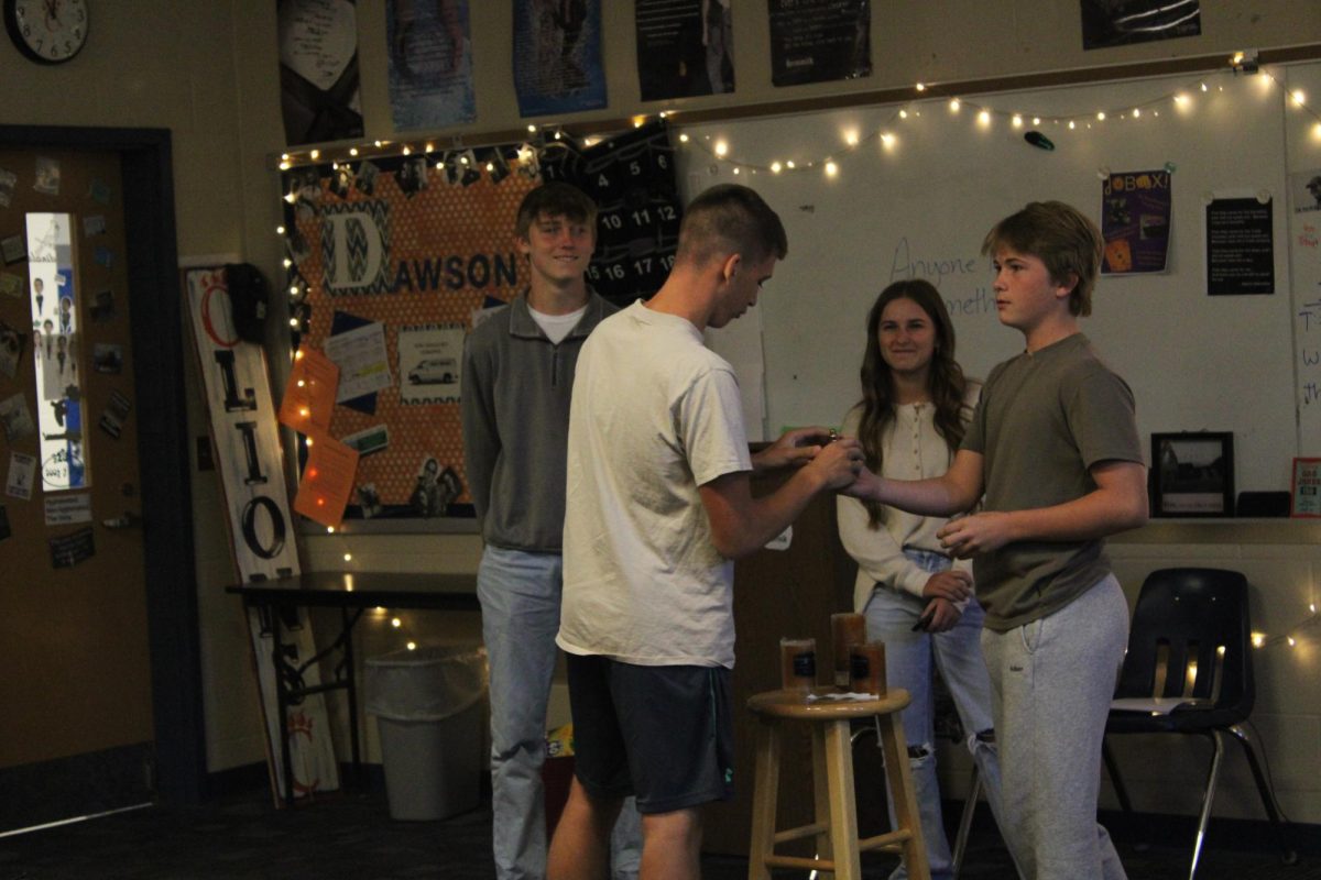Sophomores Olin Clark, Bailie Sims, Lane Sykes, and Brezden Burkey, doing their presentations for Mrs. Dawson's English II class while getting ready for upcoming final exams. 