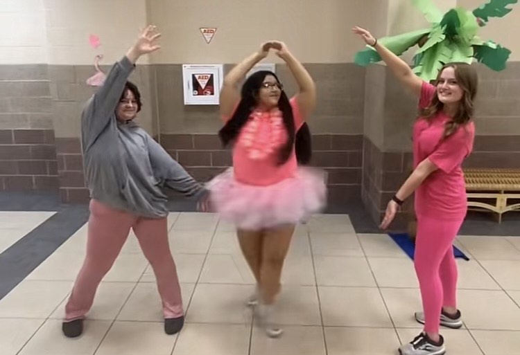 Seniors Ash Keim, Amelia Cottrell, and Edelia Amaro showing of their outfits for spirit week.