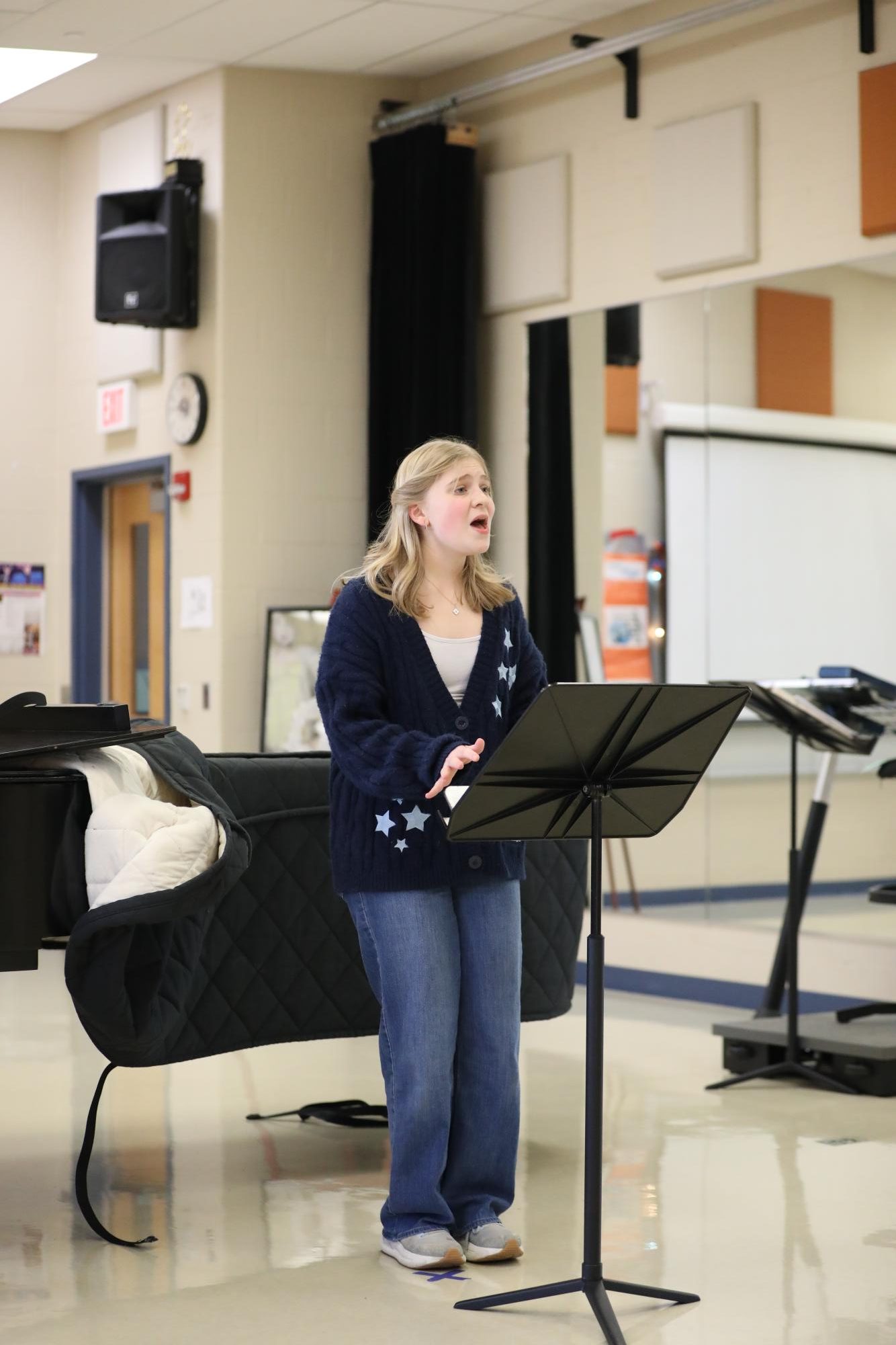 Sophomore Anne Poppit singing through her audition for the musical.
