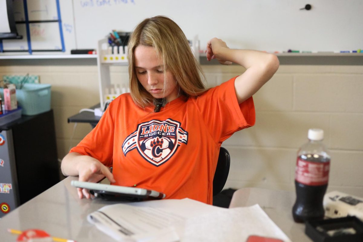 Freshman Grace Chapman is working on her assignment for the Radio News competition.