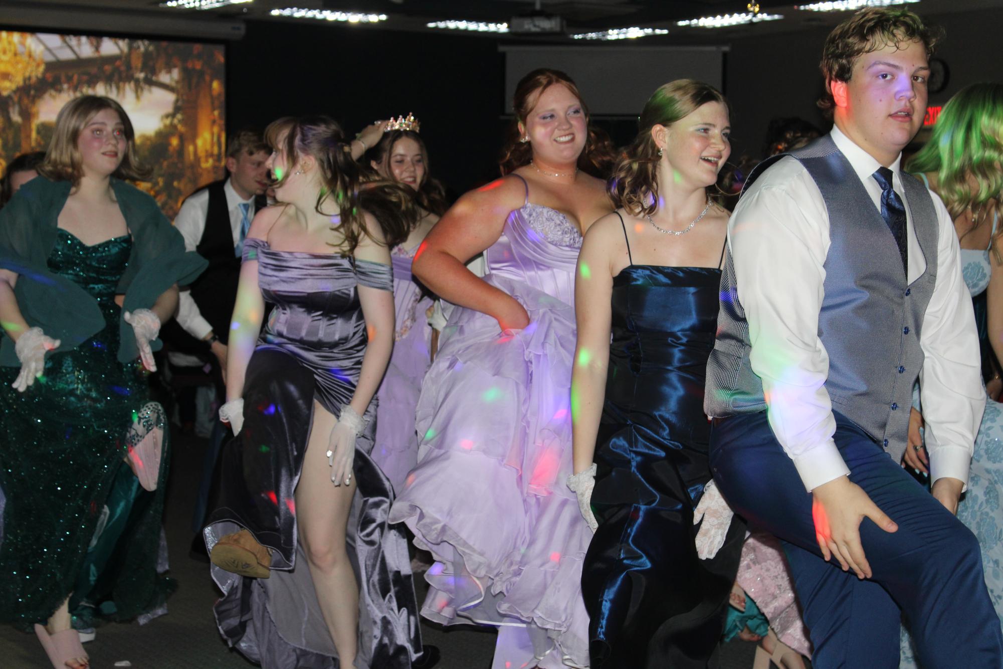 Juniors Evan Miranti, Sadie Kidd, McKenna Stock, Chloe Williams, and sophomore Anne Popit dancing to the song church clap at prom.
