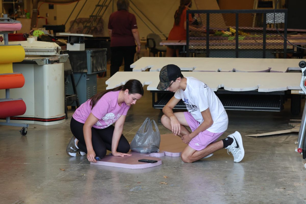 Seniors Taryn Ford and Noah Sanchez work on the senior homecoming float back in October 2025.